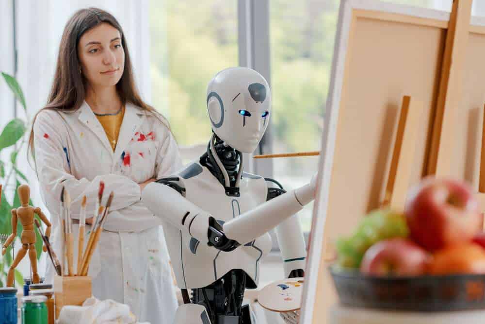 AI robot learning how to paint on canvas in the art studio, a young teacher is training her
